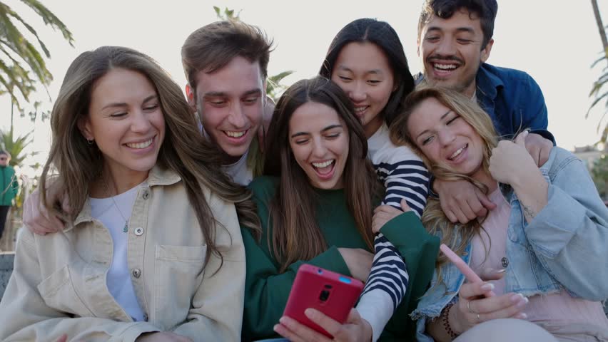 Young asian woman showing funny social media content to her friends. Student millennial people having fun watching streaming videos on smart phone digital app. Technology lifestyle Royalty-Free Stock Footage #1104146453