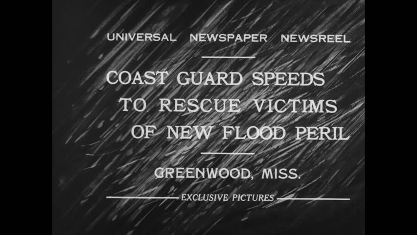 Circa 1932 - us coast guardsmen and african-american prisoners prepares boats and sandbags to help after a flood in greenwood, mississippi.