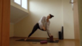 blurry video of beginner yogi doing home practice