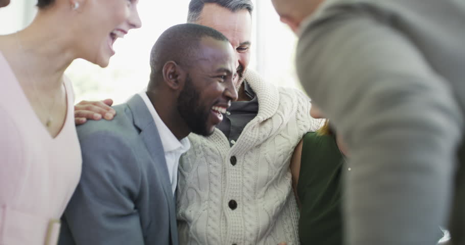 Collaboration, motivation and a group of friends laughing while standing in a huddle at their workplace together. Teamwork, success and celebration with business people happy in their office at work Royalty-Free Stock Footage #1104163913