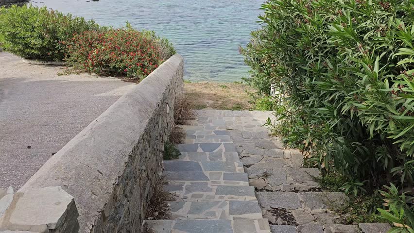 Steps towards the beach in Paros, Greece.