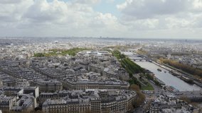 Flying towards Grand Palais along Seine River and old buildings in Paris