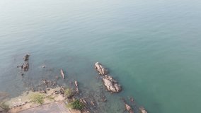 4k Video , road along the sea, Beach and waves from top view. Turquoise water background from top view. Summer seascape from air. Top view from drone. Travel concept and idea