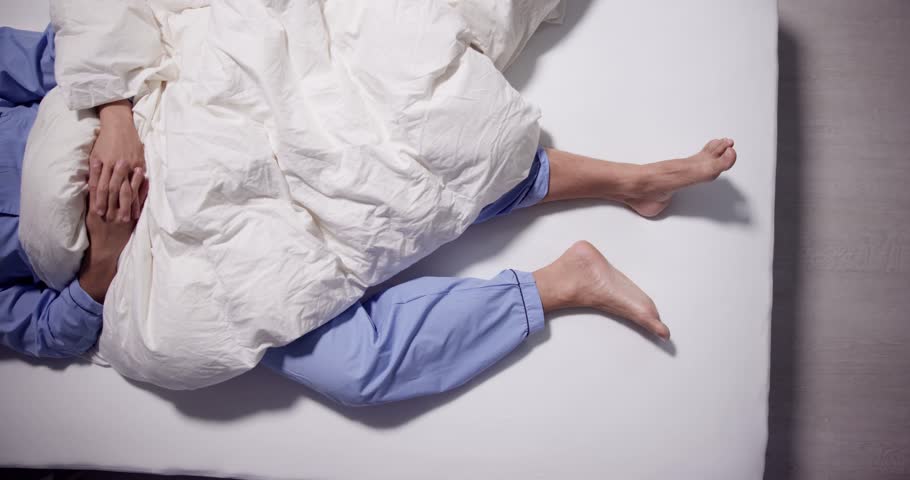Man With RLS - Restless Legs Syndrome. Sleeping In Bed Royalty-Free Stock Footage #1104174835