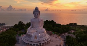 aerial view around Phuket big Buddha in beautiful sunset.
360 degree view on Phuket big Buddha viewpoint.
Video clips for travel and religious ideas.
smooth cloud in stunning sky background

