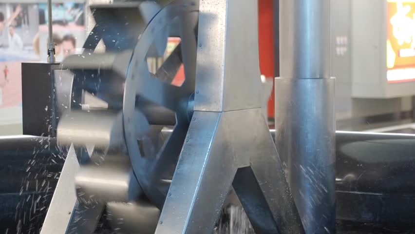 Footage of Metal water turbine slow spinning to generate free and green electricity Royalty-Free Stock Footage #1104189255