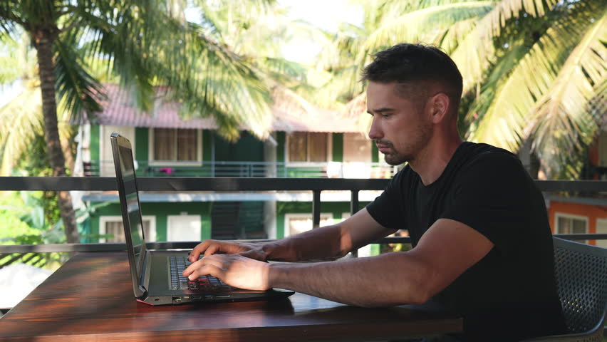 Freelancer distant online work. Business man type on computer. Person sit outside palm tree cafe. Freelance people web study outdoor Asia. Male boss use laptop. Remote internet start up. Busy guy job. Royalty-Free Stock Footage #1104191961