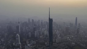 Aerial view hyperlapse 4k video of Kuala Lumpur city center view during dawn overlooking the city skyline in Federal Territory, Malaysia. Pan right