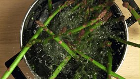 The asparagus falls into the pot. Filmed is slow motion 1000 fps. High quality FullHD footage - Powered by Shutterstock - Get 15% off with code: PIKWIZARD15