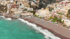 Breathtaking drone footage captures stormy day in Positano, Italy, revealing vibrant hills adorned with colourful houses and buildings - Powered by Shutterstock - Get 15% off with code: PIKWIZARD15