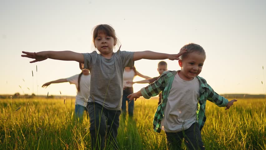 happy family. people in park kid children together run in park at sunset silhouette. brother sister daughter son run. happy family and little baby child summer. kid dream concept. children run fun