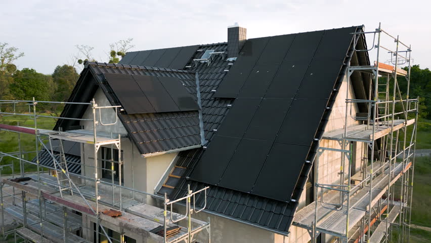Construction site of a sustainable single family house with solar panels | Shutterstock HD Video #1104201709