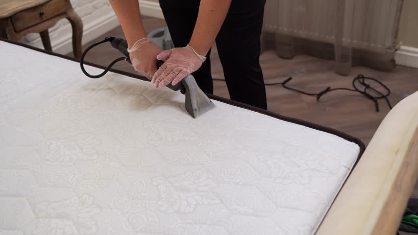 Process of extraction dirt from mattress using extractor cleaning machine. Dry wash cleaner is removing dirt and dust from mattress dry cleaning extraction machine. | Shutterstock HD Video #1104206431