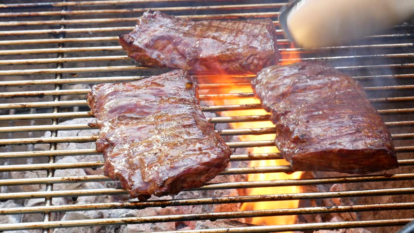 Detail of Cooking meat skirt steak on the grill