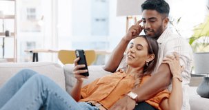 Couple, phone and relax on couch with social media app, blog or funny video on web in home. Man, woman and smartphone on sofa with conversation, reading and laughing with communication on internet