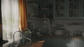 Young blonde cute woman holding holding cup of hot drink, makes a deep breath, relaxes enjoying her morning aroma coffee, standing by window in the cozy home kitchen at weekend day. People. Lifestyle - Powered by Shutterstock - Get 15% off with code: PIKWIZARD15