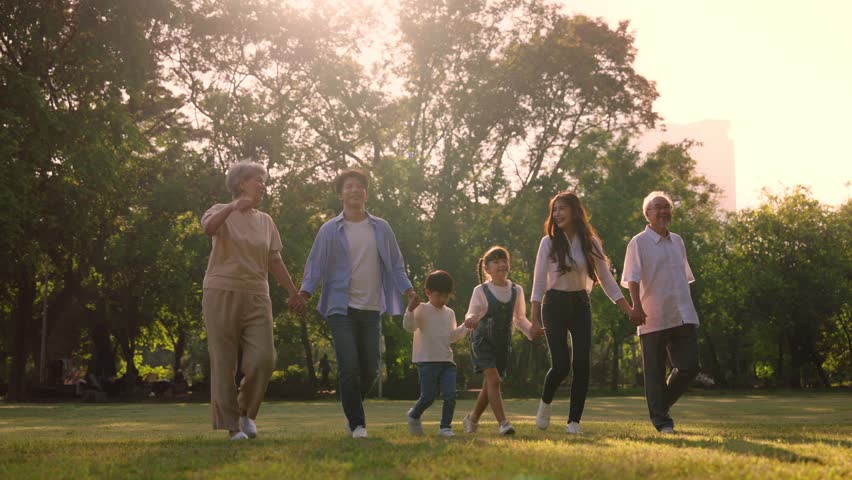 Happy Asian family walking in the nature park, Outdoor with big family and summer season concept Royalty-Free Stock Footage #1104221071