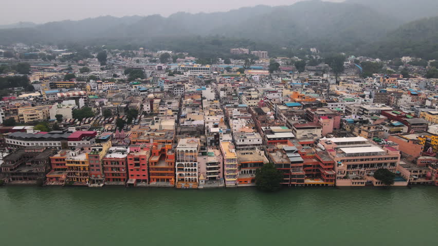 Aerial view of Haridwar City in Uttarakhand, situated on the banks of the holy River Ganga. Beautiful Indian city. Developing India concept. A holy place for Hindu religious devotees in India. Royalty-Free Stock Footage #1104224851