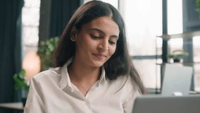 Arabian businesswoman gen z Indian business woman working in office with computer software startup project online typing busy with job at workplace happy Arabian girl company employee work with laptop - Powered by Shutterstock - Get 15% off with code: PIKWIZARD15