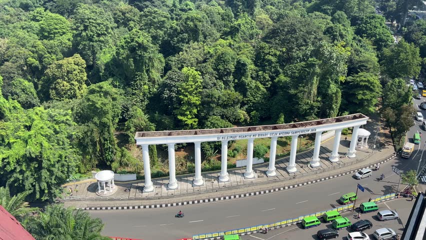 Bogor , West Java , Indonesia - 04 22 2023: Botanical Garden and traffic around Bogor city