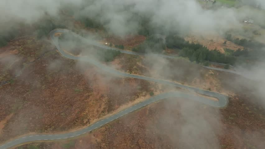 Winding road in in Norway. Flying over the clouds