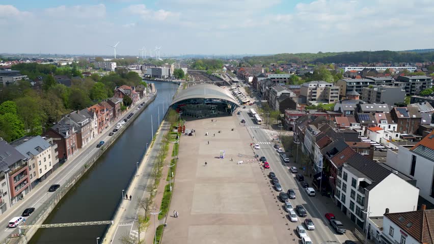 Halle, Flemish Brabant Region, Belgium, 01 05 2023, aerial top down view of the railway station and the sea canal in the city of Halle on a sunny spring day. High quality photo. High quality photo
