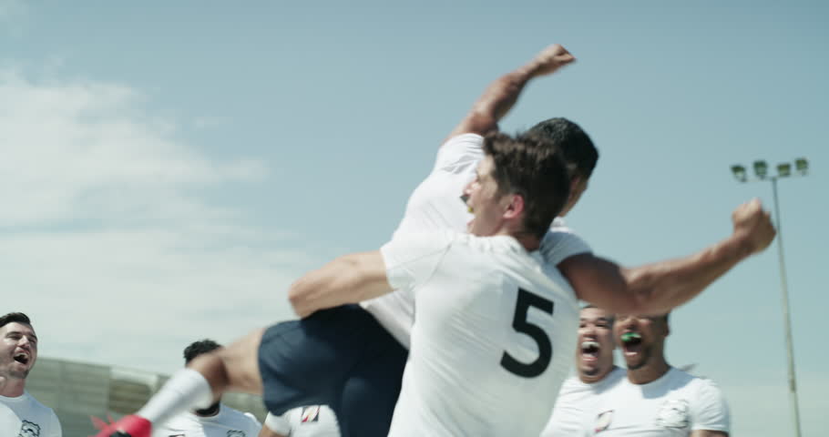 Sports, rugby and team celebrating and winning on a field together for victory or try. Teamwork collaboration, achievement and success for sport teammates with celebration after win performance Royalty-Free Stock Footage #1104246035