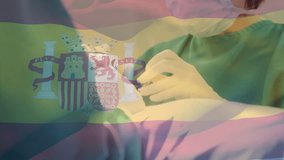 Animation of waving spanish flag over caucasian female surgeon performing surgery at hospital. National medical healthcare technology concept - Powered by Shutterstock - Get 15% off with code: PIKWIZARD15