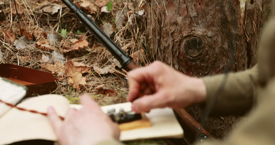 Russian Soviet Infantry Red Army Soldier In World War II using Russian Soviet Portable Radio Transceiver In Trench Entrenchment In Spring Autumn Forest. 4K. Headphones And Telegraph Key. Close Up