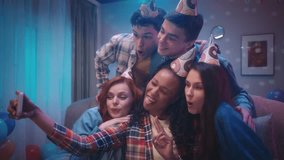 African American girl takes a selfie with friends. A group of young people take pictures, show the victory gesture, send air kisses and stick out their tongue. Slow motion. - Powered by Shutterstock - Get 15% off with code: PIKWIZARD15