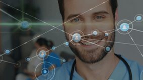 Animation of network of connections with icons over caucasian male doctor smiling. Global business, medicine and digital interface concept, digitally generated video. - Powered by Shutterstock - Get 15% off with code: PIKWIZARD15