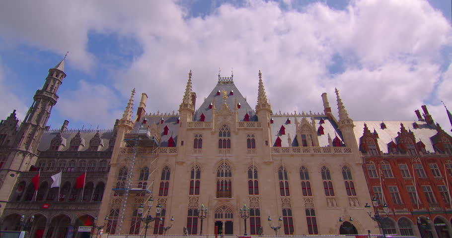 Brugge, Belgium establisher wide view. Time lapse medieval facades of houses. Clouds move in the background. Landmarks of Belgium architecture of Bruges. Protected monument of architecture