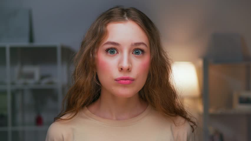 Portrait of Young Woman with Surprised Face Looking at Camera and Smiling. Wow Effect of Product Advertising for Happy Female Person. Feelings of Excited Adult Girl Amazed by Unexpected Information Royalty-Free Stock Footage #1104267615