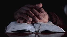 praying to God with hand on bible with people stock video stock footage