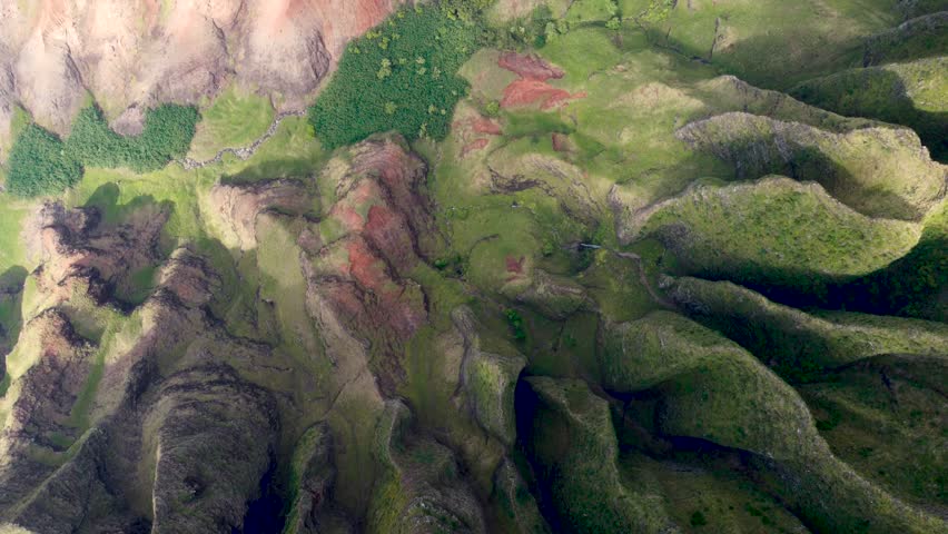 Breathtaking aerial view of Napali Coast Kauai green jungle dramaric mountain peaks, a waterfall and a river. Kauai island Hawaii USA Beautiful nature of Na Pali park. | Shutterstock HD Video #1104277209