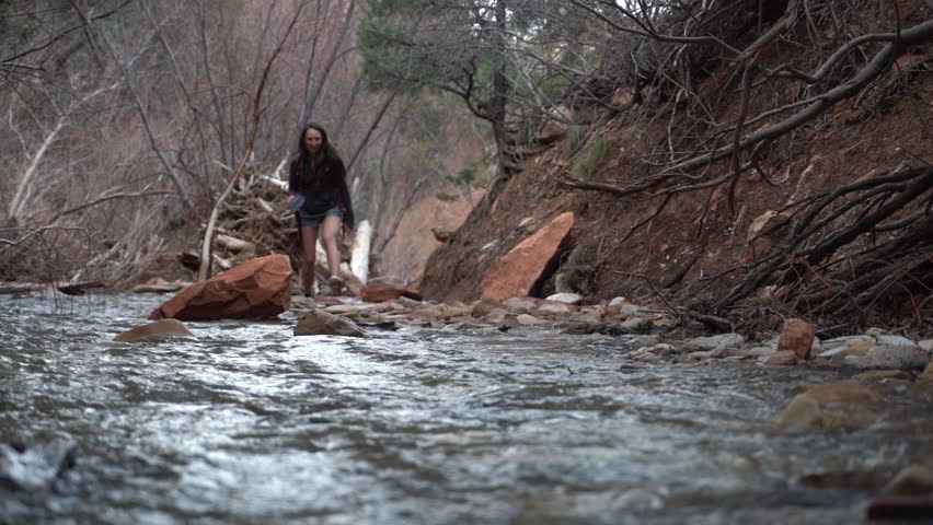 Female Hiker Walking in Creek Canyon, Kanarraville Falls Hiking Trail, Utah USA