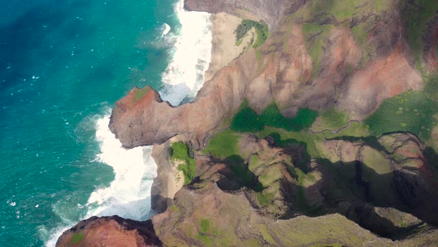 Dramatic aerial view of Napali Coast Kauai island Hawaii USA with dramatic mountains, blue ocean . Beautiful nature drone flying over green jungle mountain peaks. Tropical coastline. | Shutterstock HD Video #1104277239