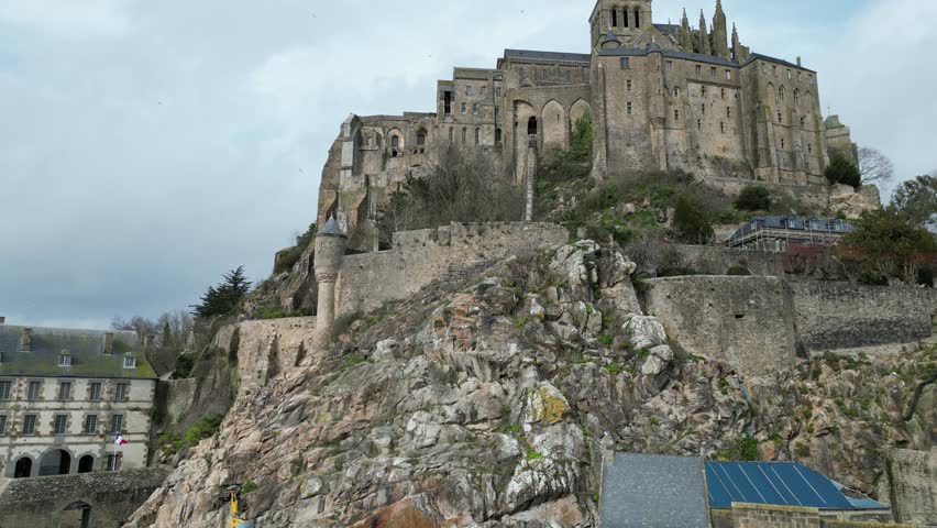 Mont Saint-Michel: Aerial Journey from Ground to Top | Shutterstock HD Video #1104278147