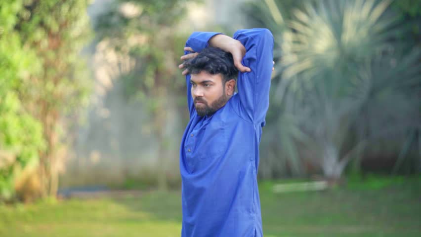 Indian man stretching and doing yoga