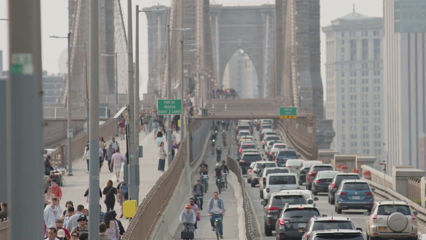 telephoto shot of pedestrian, bike and car traffic on Brooklyn Bridge Royalty-Free Stock Footage #1104282113