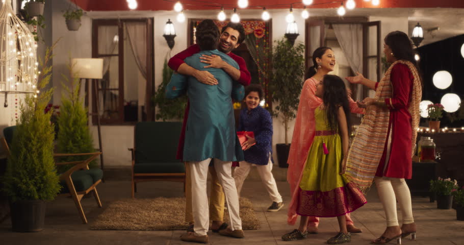Authentic Shot of Indian Family Receiving Family Over as Guests. Genuine Happiness in a Reunion Between Friends to Celebrate Diwali Together. Young Parents and Kids Happily Greeting. Slow Motion Royalty-Free Stock Footage #1104284253