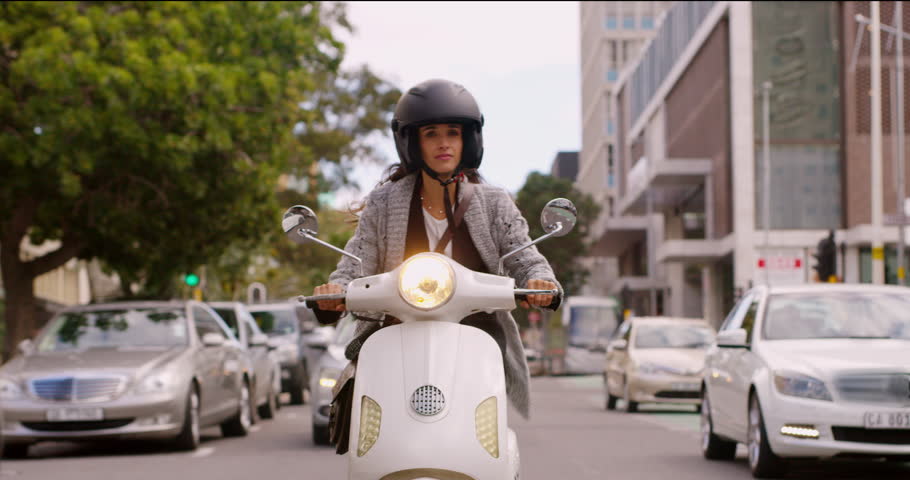 Scooter, travel and woman ride in city on street for commute, transport and journey in town. Traveling, adventure and female person on motorcycle vehicle for drive or transportation in Cape Town