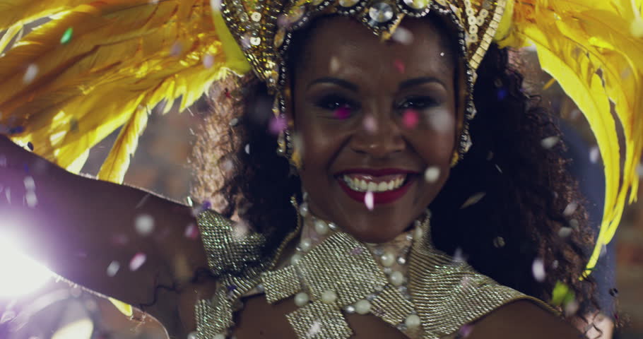 Dancing, cultural and woman at traditional mardi gras, party or parade with confetti in Brazil. Celebration, festival and portrait of happy female dancer dancing in costume at a carnival performance. | Shutterstock HD Video #1104291601