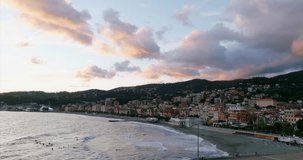 Aerial panoramic view of Varazze beach and town at sunset, Italy. Space for copy
