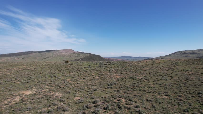Looking over the hills of Casper Wyoming and the North Platte River starting from Casper Mountain with 4k drone