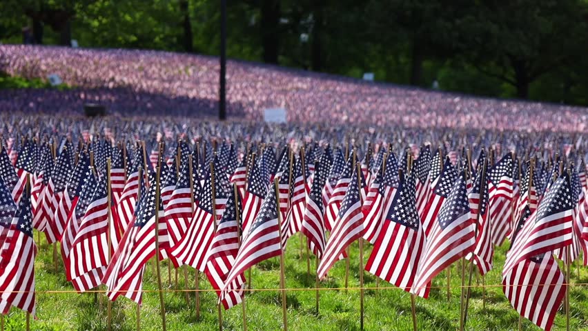 37,000 US flags planted in Boston Common, to commemorate fallen soldiers in wars, during Memorial Day weekend Royalty-Free Stock Footage #1104300531
