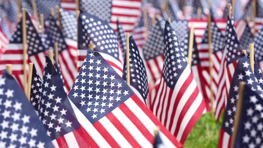 37,000 US flags planted in Boston Common, to commemorate fallen soldiers in wars, during Memorial Day weekend Royalty-Free Stock Footage #1104300533