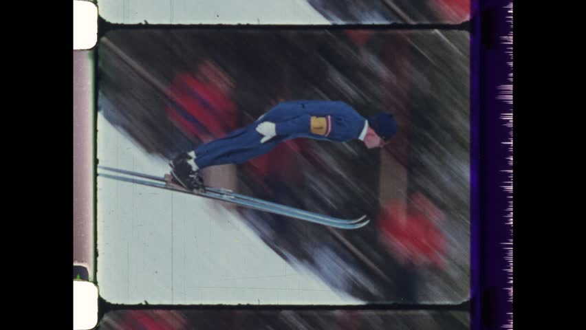 1982 Oslo, Norway. Montage of Ski Jumping. Various skiers fly through the air in various Nordic skiing techniques. Ski Jumper falls and crahes down ski slope. 4K Overscan of vintage archival film 