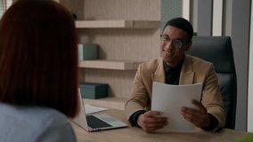Smiling African American businessman man employer talk to woman hiring candidate job interview take resume business recruitment at workplace listen client at office meeting offer documents insurance - Powered by Shutterstock - Get 15% off with code: PIKWIZARD15