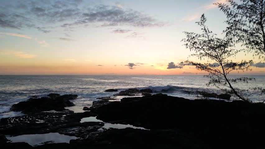 Ocean sunrise in Hawaii. Waves crashing on the beach | Shutterstock HD Video #1104304765